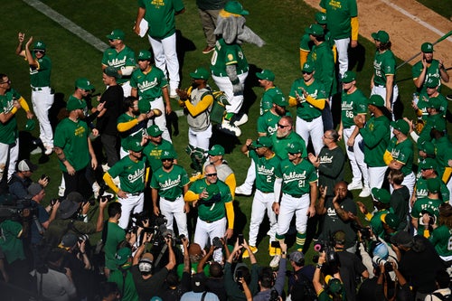 OAKLAND, CALIFORNIA - SEPTEMBER 26: Manager Mark Kotsay #7 of the Oakland Athletics waves to the crowd after his speech and their win over the Texas Rangers at the Oakland Coliseum on September 26, 2024 in Oakland, California. (Photo by Eakin Howard/Getty Images)