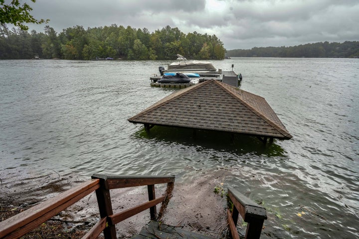 Torrential rain from Hurricane Helene has caused lake levels to rise on Lake James, resulting in flooded docks and gazebos, Friday, Sept. 27, 2024 in Morganton, N.C. (AP Photo/Kathy Kmonicek)