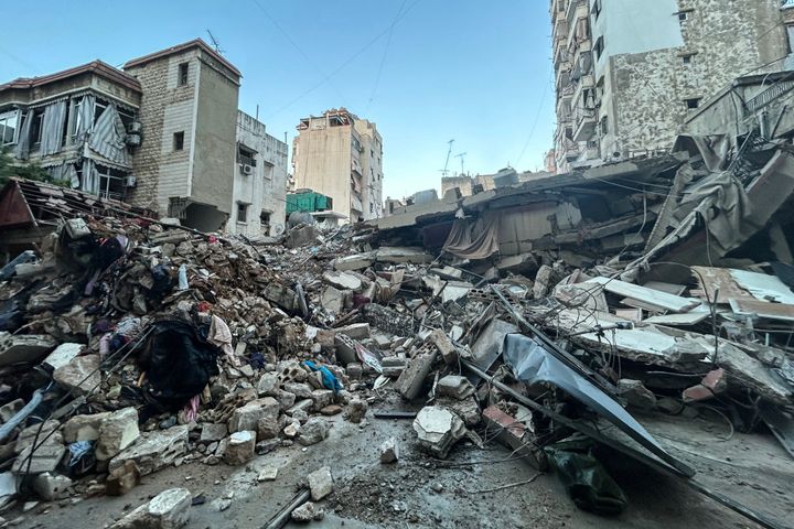 Residents' belongings are scattered amid the rubble of a building levelled in an overnight Israeli strike in the neighbourhood of Shiah in Beirut's southern suburbs on September 29, 2024. Israel said on September 29 that it was carrying out new air raids against "dozens" of Hezbollah targets in Lebanon, after killing the Iran-backed group's leader, Hassan Nasrallah. (Photo by AFP) (Photo by -/AFP via Getty Images)