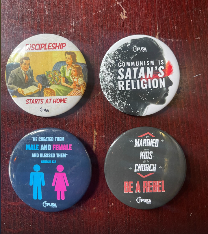 At a stop on the "Courage" tour, a neo-Charismatic Christian revival in Monroeville, Pennsylvania, on Sept. 28, 2024, the far-right MAGA group Turning Points USA Faith passed out buttons.