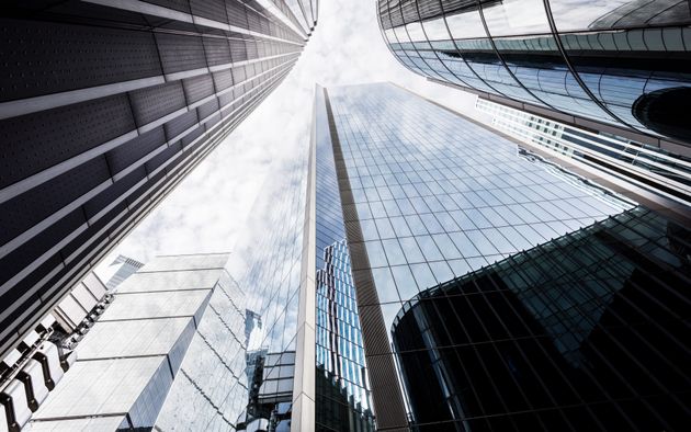 Low angle view of modern glass skyscrapers, City of London, UK