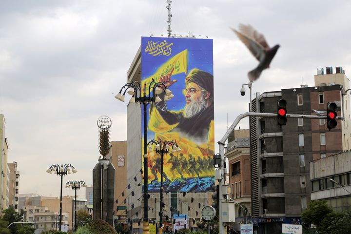 TEHRAN, IRAN - SEPTEMBER 30: A portrait of Hezbollah's Secretary-General Hassan Nasrallah who was killed in an Israeli strike in the Lebanese capital on Friday, is hung on a building in Tehran, Iran on September 30, 2024. (Photo by Fatemeh Bahrami/Anadolu via Getty Images)