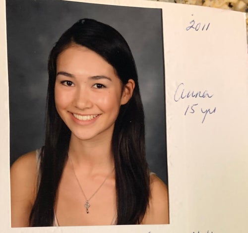 The author is pictured in high school, at 15 years old.