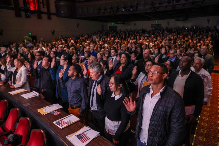 Nearly 700 immigrants are sworn as U.S. citizens at a naturalization ceremony in California in September. Purges of supposed noncitizen voters routinely sweep up naturalized citizens.