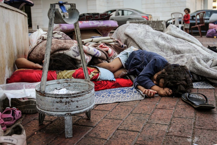 Lebanese children, who fled a southern suburb of Beirut with their families, sleep on pavement in Beirut after they failed to find a public school or a shelter to go to. Thousands of Lebanese and Syrians nationals have fled south Lebanon, the suburbs and Lebanon's Bekaa valley east of the country because of the daily Israeli air raids.