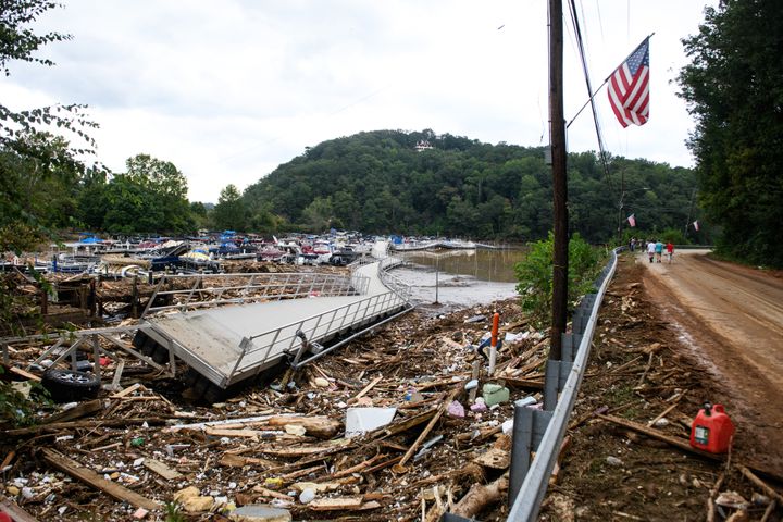 The Rocky Broad River flows debris from the village of Chimney Rock into Lake Lure after heavy rains from Hurricane Helene on Sept. 28. Approximately six feet of debris piled on the bridge from Lake Lure to Chimney Rock, blocking access.