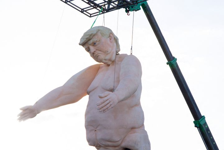 A 43-foot-tall (13 meters) naked statue resembling former US President and Republican presidential candidate Donald Trump is displayed in a fenced-in lot near Interstate 15 north of Las Vegas, Nevada, September 28, 2024. 