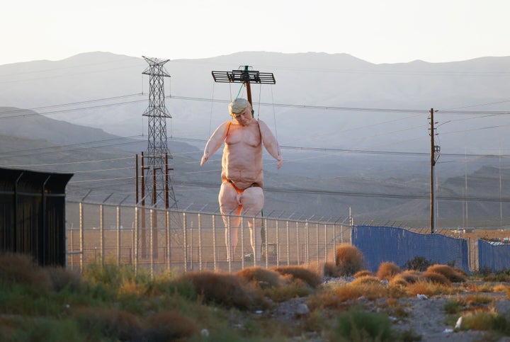 The naked Trump statue stands 43 feet tall.