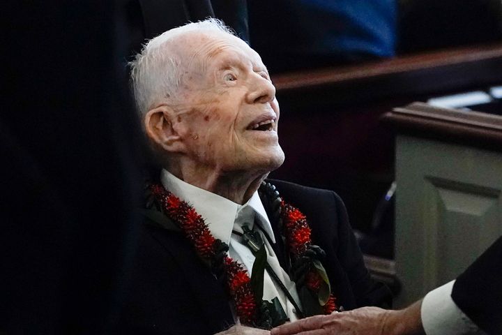 FILE - Former President Jimmy Carter greets attendees as he departs the funeral service for his wife, former first lady Rosalynn Carter, at Maranatha Baptist Church in Plains, Ga., Nov. 29, 2023. (AP Photo/Alex Brandon, Pool, File)