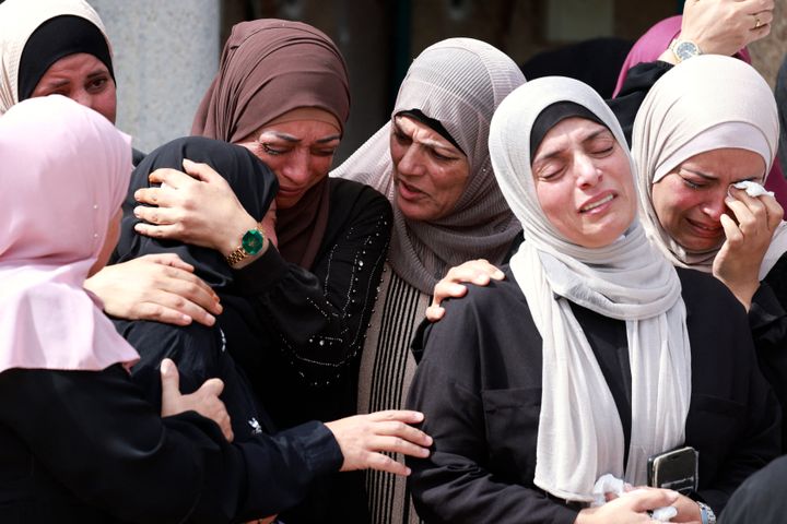 TOPSHOT - EDITORS NOTE: Graphic content / Mourners attend the funeral of Palestinian Deya Dwakat who was killed in an Israeli military raid the previous day in the occupied West Bank, in Balatah on October 2, 2024. (Photo by Jaafar ASHTIYEH / AFP) (Photo by JAAFAR ASHTIYEH/AFP via Getty Images)