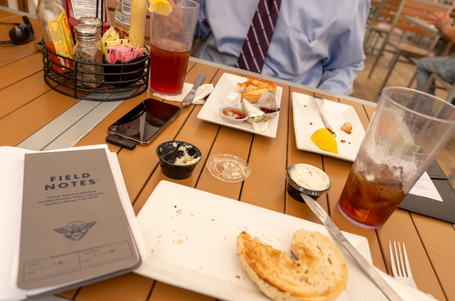 The author sitting across from "Bunchanumbers" at their meal at Parkway Deli in Silver Spring, Maryland.