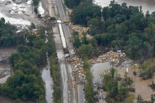 Roads are seen damaged and covered with debris on Sept. 28 after Hurricane Helene swept through the area. The raging waters swept 11 people from a nearby plastics factory, and only five were rescued.