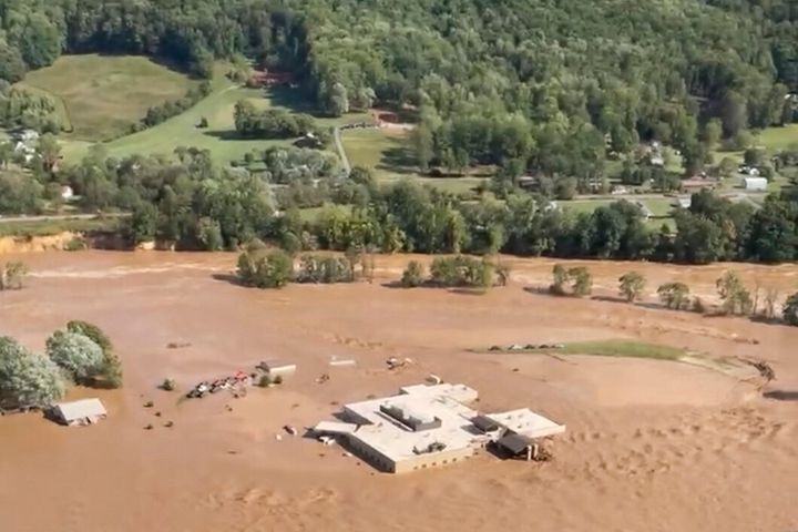 The Unicoi County Hospital in Erwin, Tenn., is seen surrounded by floodwaters from Hurricane Helene on Sept. 27. Patients and staff had to be rescued from the roof.