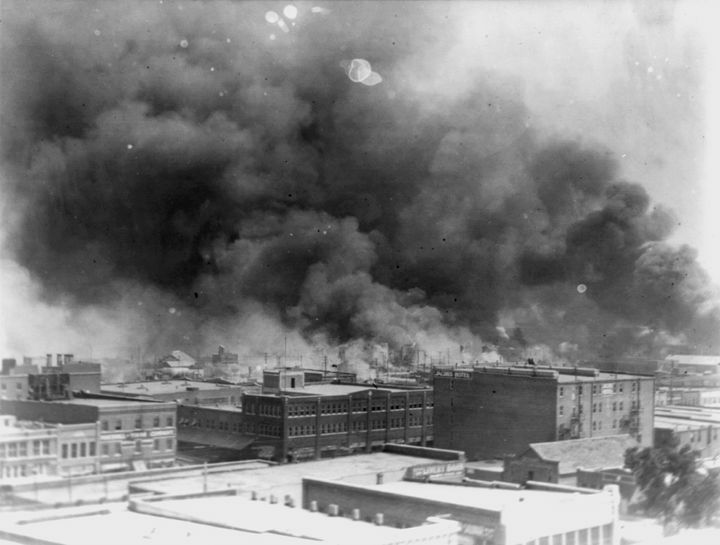 In this 1921 image provided by the Library of Congress, smoke billows over Tulsa, Oklahoma. The Department of Justice announced Thursday that it will review the massacre as part of its newly enhanced ability to study cold cases.