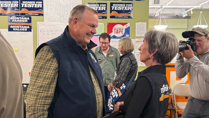 Sen. Jon Tester (D-Mont.) greets supporters at a campaign field office in Great Falls, Montana.