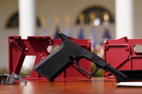 A polymer frame for a 9-millimeter ghost gun kit with a commercial slide and barrel and a polymer frame is displayed in the White House Rose Garden on April 11, 2022.