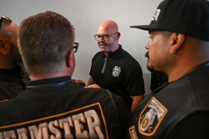 Teamsters President Sean O'Brien shakes hands with workers during a rally. O'Brien took the unusual step of speaking at the RNC as the leader of a major union.