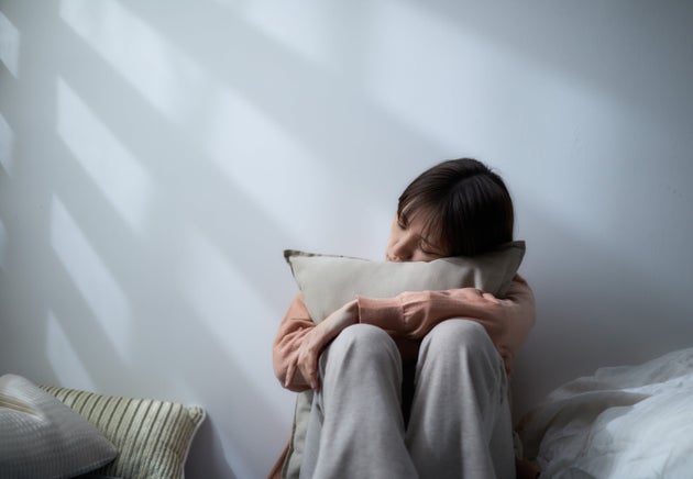 Japanese woman depressed in bed