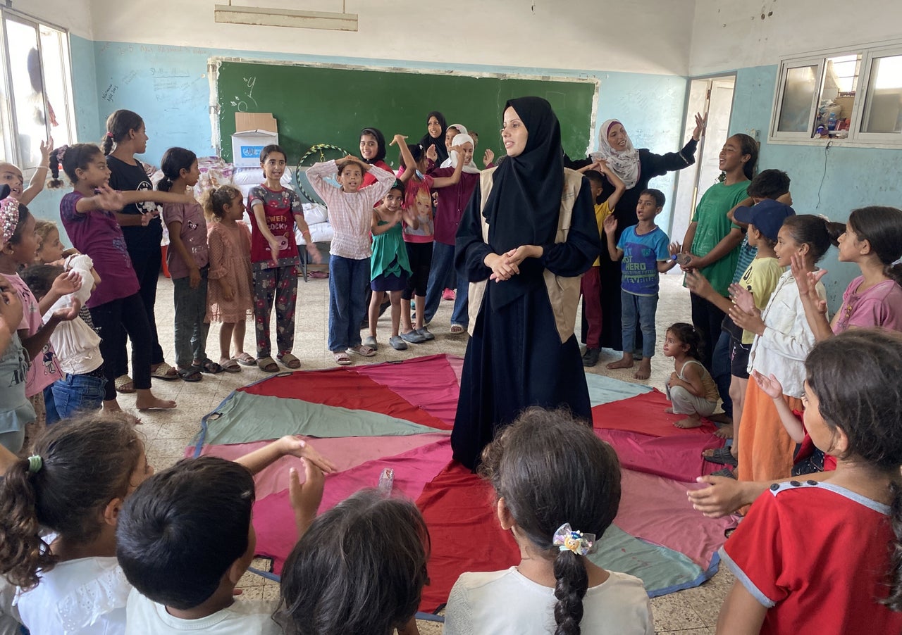 A group of young volunteers organizes psychological support sessions, games and entertainment activities on July 17 for Palestinian children at the Teacher Creativity Center in Khan Younis, Gaza.