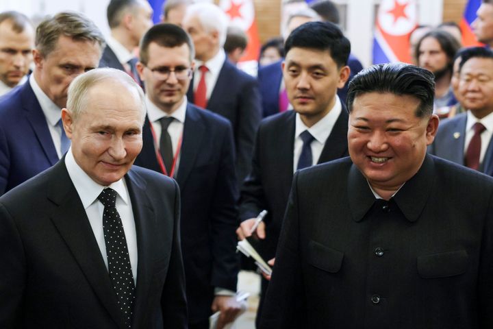 Russian President Vladimir Putin, left, and North Korea's leader Kim Jong Un smile as they walk after the talks in Pyongyang, North Korea, on Wednesday, June 19, 2024.