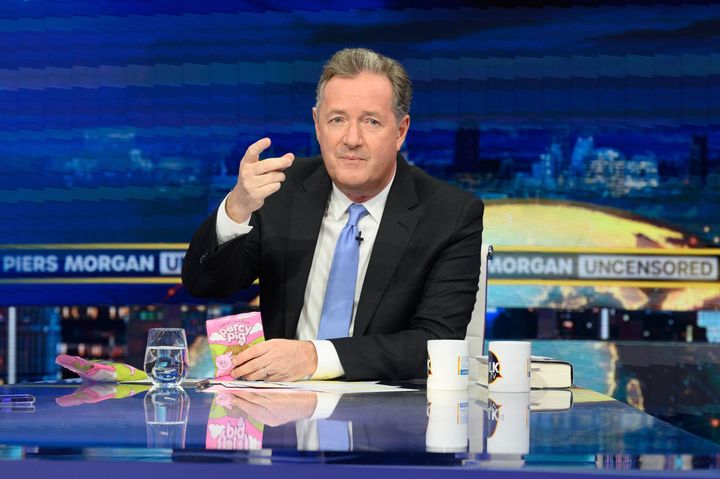 Piers Morgan eating some Percy Pig sweets on the set of his show Uncensored in 2022