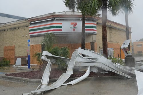 An apparent tornado caused by Hurricane Milton, tore the awning off a 7-Eleven convenient store, on Oct. 9, 2024, in Cape Coral, Fla. 