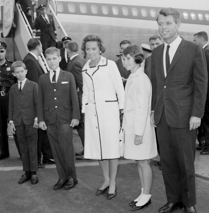 Robert F. Kennedy, right, wife Ethel Kennedy, and children, from left, Bobby, Joseph, and Kathleen, second right, pose at Kennedy International Airport in New York, July 1, 1964, shortly after they returned from a one-week trip to West Germany and Poland. (AP Photo/Matty Zimmerman, File)