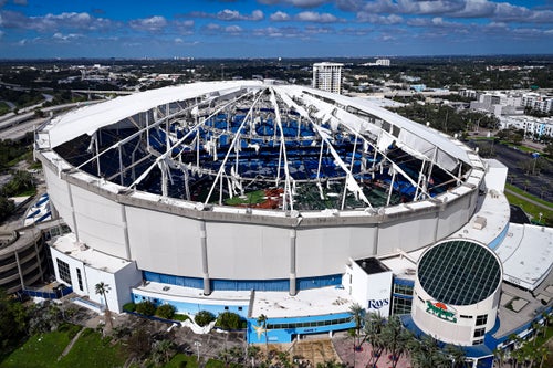A drone image shows the dome of Tropicana Field which has been torn open due to Hurricane Milton in St. Petersburg, Florida, on October 10, 2024. (Photo by Miguel J. Rodriguez Carrillo / AFP via Getty Images)