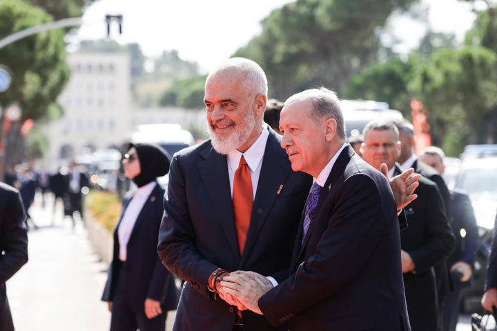 Prime Minister of Albania Edi Rama, left, welcomes Turkey's President Recep Tayyip Erdogan before their meeting in Tirana, Albania, Thursday, Oct. 10, 2024. (AP Photo/Hameraldi Agolli)