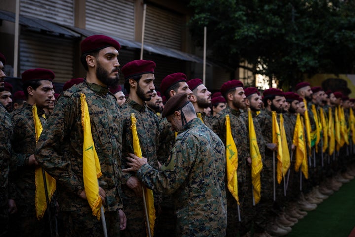 Hezbollah fighters line up to attention at the funeral of the Radwan Forces commander Ibrahim Aqil and commander Mahmoud Hamad, both killed in an Israeli airstrike on a residential building in the Dahiyeh suburb of Beirut, Lebanon.