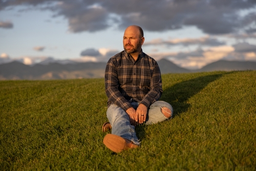 Arnold Kleinsasser sits at a park near his home in Montana on Sept. 13, 2024. Kleinsasser, who was a victim of the robbery that led to his friend Ronnie Wipf's death, does not support the death penalty for Tremane Wood. 