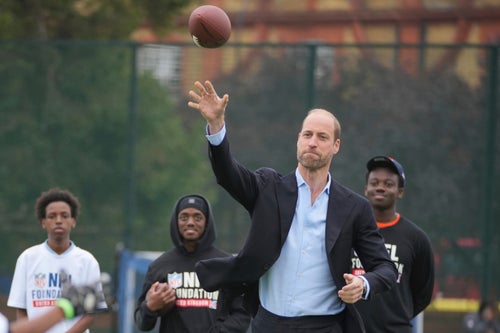 Prince William played catch with British teenagers at a flag football event organized by the NFL on Tuesday.