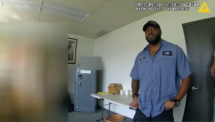 Police body camera footage shows Nathaniel Huey Jr. being interviewed at his workplace.