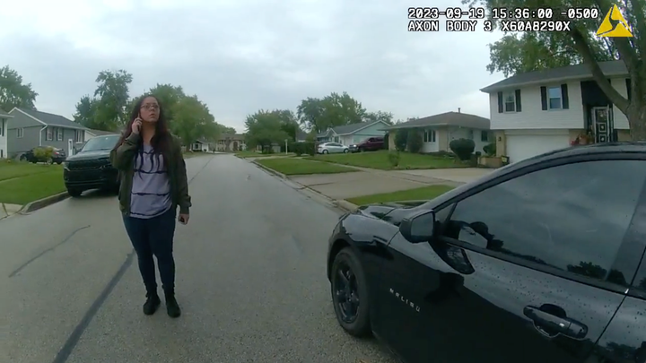 Palomo is seen via a police body camera attempting to enter her car.