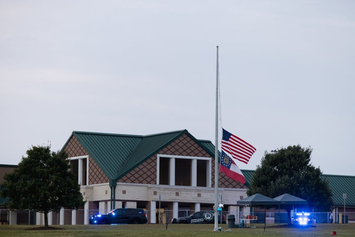 Flags are lowered at half-staff in front of Apalachee High School on Sept. 5 after two students and two teachers were shot dead.