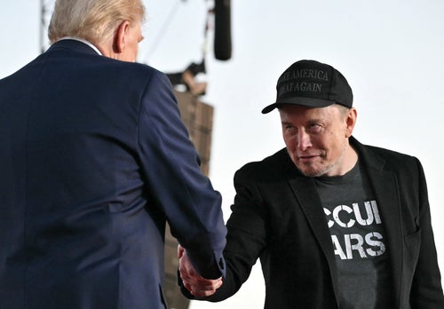 Tesla CEO Elon Musk (R) joins former President and Republican presidential candidate Donald Trump during a campaign rally at site of his first assassination attempt in Butler, Pennsylvania, on Oct. 5.