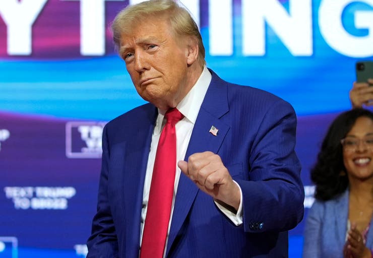 Republican presidential nominee Donald Trump moves to the Village People's "Y.M.C.A." at a campaign event Monday in Oaks, Pennsylvania.