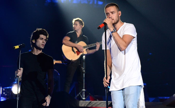 Zayn Malik (l.) und Liam Payne (r.) treten am 4. August 2014 im MetLife Stadium in New York auf. Malik trauert um ihn "Bruder" und der Bandkollege in einem rührenden Statement auf Instagram am Donnerstag.