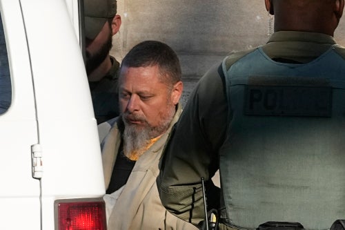 Officers escort Richard Allen out of the Carroll County courthouse following a hearing, Nov. 22, 2022, in Delphi, Indiana.