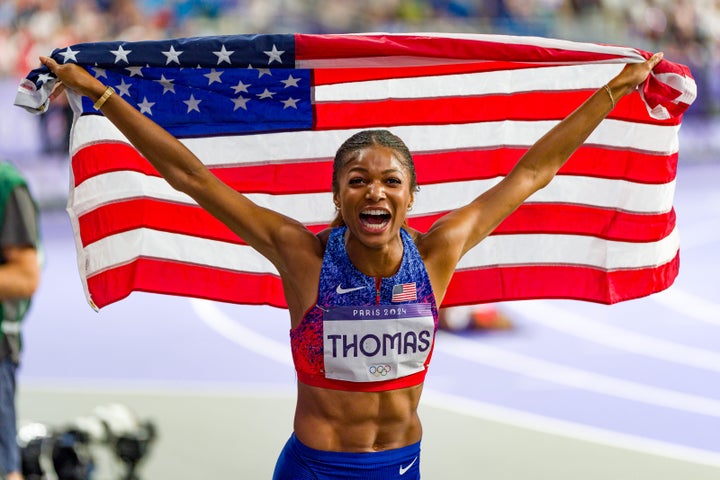 Gabby Thomas celebrates after winning her 200-meter gold medal.