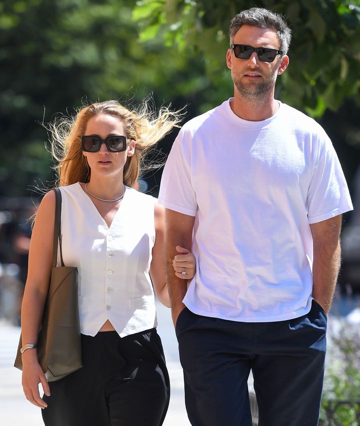 Jennifer Lawrence and husband Cooke Maroney walk around New York's Manhattan neighborhood in August 2023. The pair are expecting their second child.