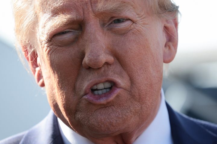 Republican presidential nominee, former US President Donald Trump, addresses the media as he arrives at Detroit Metropolitan Wayne County Airport on October 18, 2024.