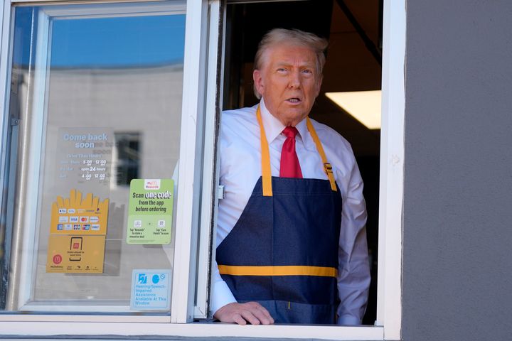 Republican presidential nominee former President Donald Trump stands at the drive-thru window during a campaign stop at a McDonald's, Sunday, Oct. 20, 2024, in Feasterville-Trevose, Pa.