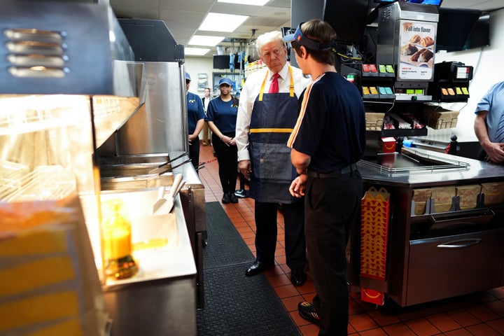 Former President Donald Trump works behind the counter making french fries during a visit to McDonald's restaurant on Oct. 20 in Feasterville-Trevose, Pennsylvania.