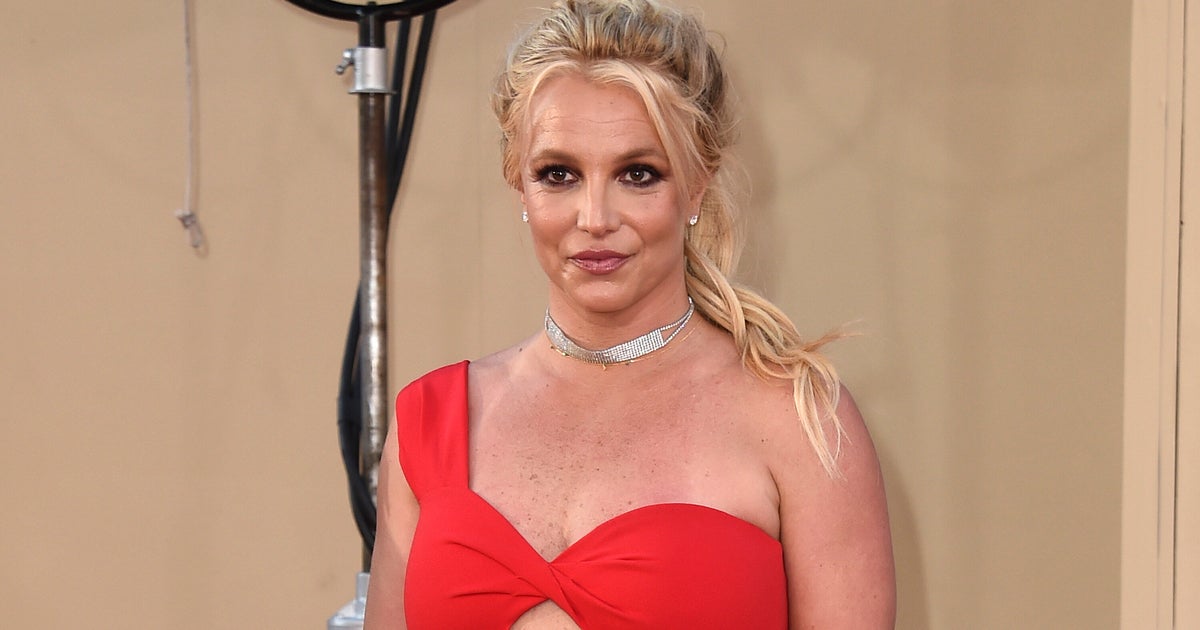 NextImg:Britney Spears Wears Wedding Dress In Puzzling Video To Say She's Married Herself