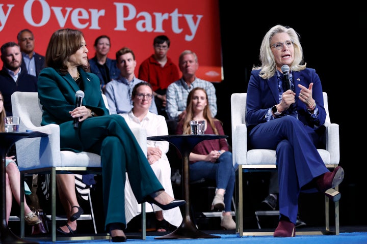 Harris listens as former Rep. Liz Cheney (R-Wyo.) speaks about how patriotic duty compelled her to back Harris' candidacy.