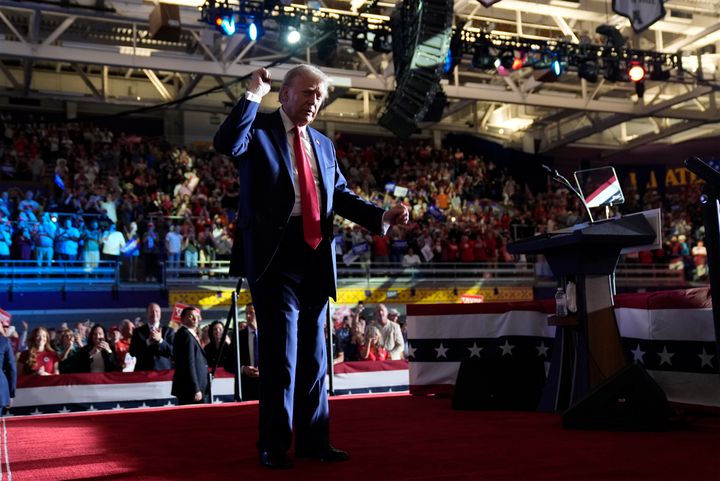 Republican presidential nominee former President Donald Trump dances after speaking at a campaign rally at Williams Arena at Mignes Coliseum, Monday, Oct. 21, 2024, in Greenville, N.C.