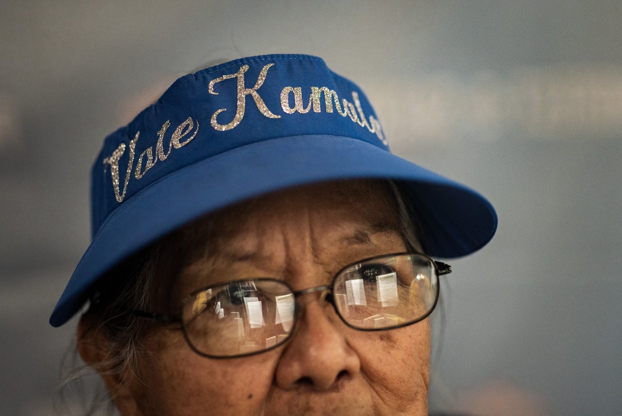 Rosalind Zah, wife of former Navajo Nation President Peterson Zah, wears her "Vote Kamala" visor hat Saturday evening in Window Rock, Arizona. 