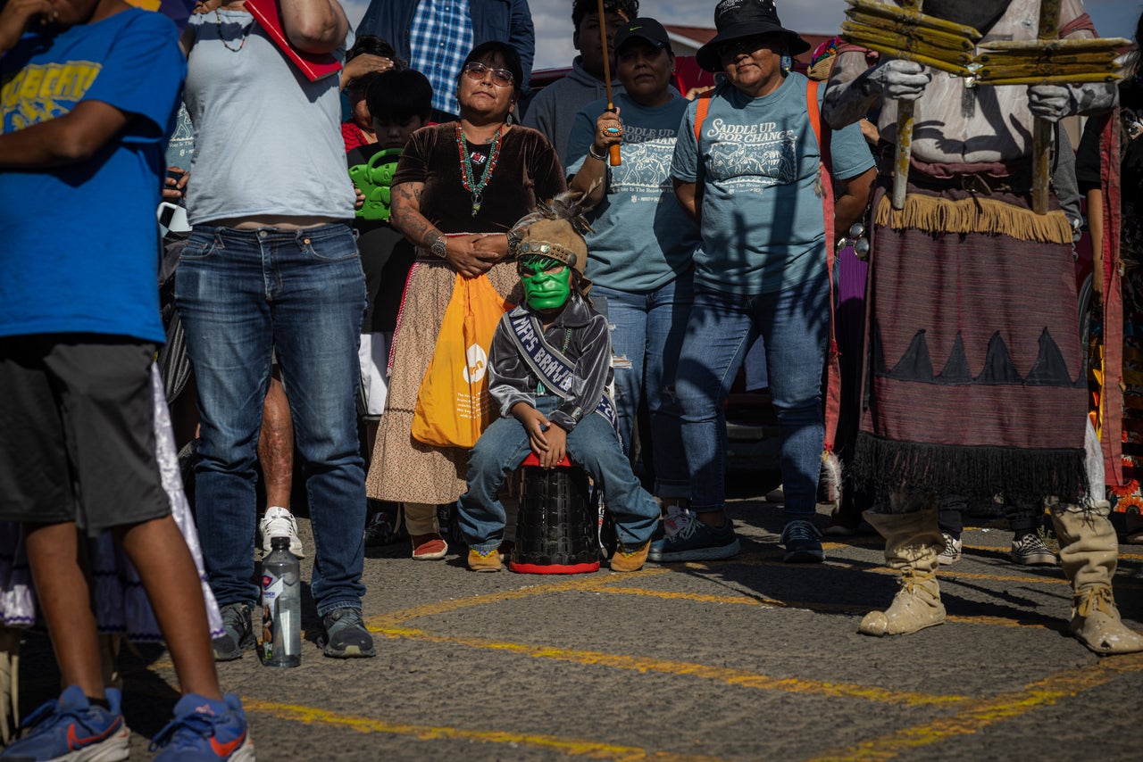 A little boy wearing a Hulk mask waits for a chance to meet actor Mark Ruffalo, who plays the Incredible Hulk in the latest Marvel movies, ahead of the Walk to the Polls event. Ruffalo later signed his mask. 