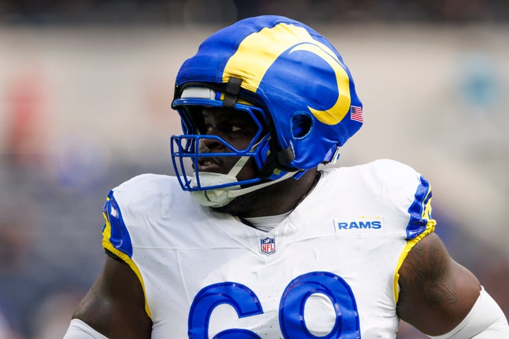 Kevin Dotson of the Los Angeles Rams wearing a Guardian Cap on his helmet in a game earlier this season.